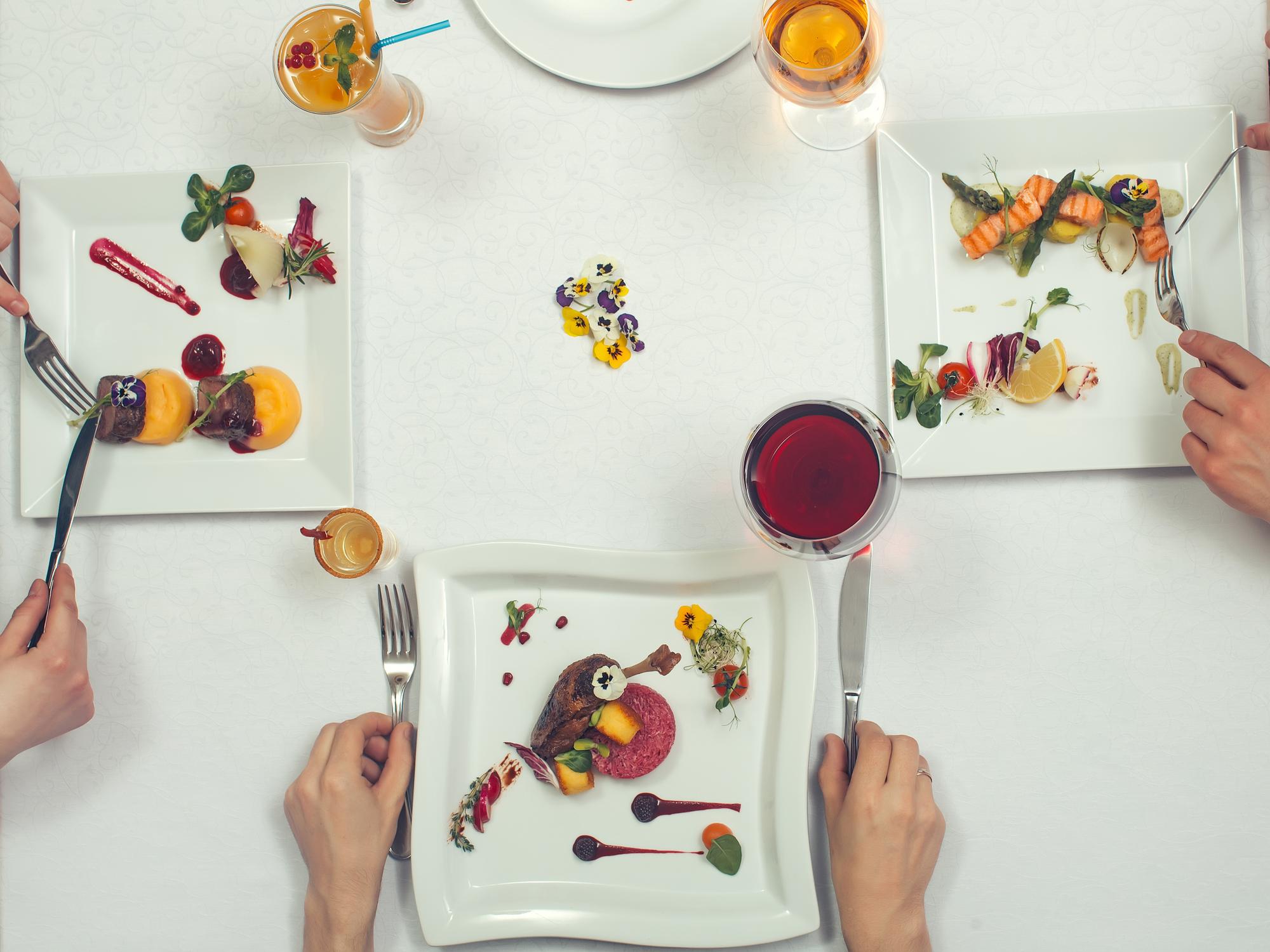 A shared table with plated tasting menu